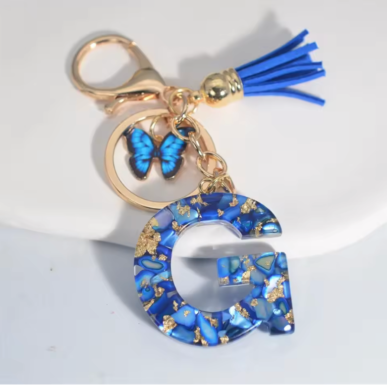 Fashion Blue Glazed Stone A To Z Letter Keychain - Stylish Keychain with Blue Glaze, Gold Accents & Blue Feather Accents