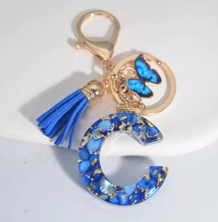 Fashion Blue Glazed Stone A To Z Letter Keychain - Stylish Keychain with Blue Glaze, Gold Accents & Blue Feather Accents